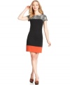 Jessica Howard's shift dress is colorblocked with a band of red at the hem and an animal print at the neck and shoulders.