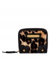 Inject eye-catching style into your statement accessories collection with Juicy Coutures bold leopard print petite wallet - Metal logo plaque, inside snapped section with bill and credit card slots, zip-around coin purse - Stash away in downsized shoulder bags or carry alone for running quick errands