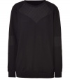 Sporty sweater in black, textured cotton is reminiscent of 1980s-style with a modern, sophisticated twist - Features decorative quilt-like contrasting inserts at the neckline and elbows - Long silhouette and nice length - Perfect choice for down time when worn with cropped jeans or boyfriend jeans and favorite flats, leather thongs, or edgy sneaks