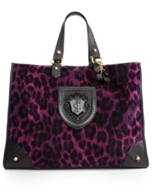 Live the luxe life, or at least look like you do with this glammed-out design from Juicy Couture. Dressed to impress in plush, velour with leopard print pattern and golden stud accents, it makes an eye-catching entrance fit for the most discerning diva.