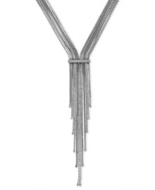 Meeting in the middle makes for an elegant look in this necklace from BCBGeneration. Crafted from silver-tone mixed metal, the chains come together and end in a stylish tassel. Approximate length: 19 inches. Approximate drop: 7 inches.