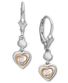 Let cupid make his mark. This romantic earring style feature petite heart charm drop accented by sparkling diamonds. Setting crafted from sterling silver and 14k rose gold accents. Approximate drop: 1-1/4 inches.