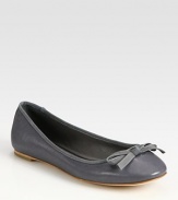 Sophisticated leather flat with grosgrain trim and a dainty bow. Leather upperLeather lining and solePadded insoleImportedOUR FIT MODEL RECOMMENDS ordering true size. 