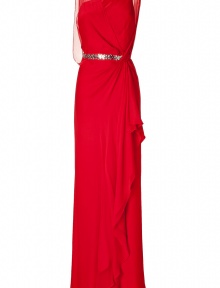 Show-stopping evening gown of red silk - Features feminine, side draping, decorative crystals at waist belt, transparent back and shoulders - Slim cut flatters the figure with asymmetric, pleating - Refined and luxurious with sexy silver sandals and a matching clutch