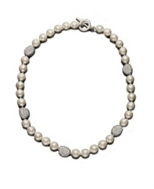 A couture collar necklace, by Lauren by Ralph Lauren. Elegant glass pearl (10 mm) is accented by crystal-encrusted nuggets of silvertone mixed metal. Approximate length: 18 inches.