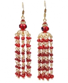 Exotically elegant. Tassels are a major trend in jewelry this season, and c.A.K.e. by Ali Khan conveys the look perfectly in these dramatic red drop earrings. Crafted in gold tone mixed metal, they're embellished with crystals and glass rondelle beads. Approximate drop: 2-4/10 inches.