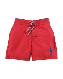 An embroidered Big Pony gives a heritage look to a brightly hued swim trunk in soft, lightweight woven cotton.