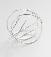 From the Alliance Collection. A sleek tube of sterling silver crisscrosses the wrist in this alluringly simple design by Allan Scharff.Sterling silverDiameter, about 3Width, about 3Imported