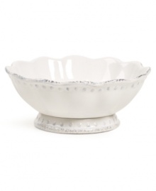 A delicate scalloped edge, graceful beading and gently distressed accents give this small Blanc serving bowl the classic, romantic feel of Versailles Maison's dinnerware collection.