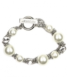 Wrap your wrists in something luxurious. Givenchy's sophisticated flex bracelet features white glass pearls and sparkling crystals set in silver tone mixed metal. Bracelet features a toggle closure. Approximate length: 7-1/2 inches.