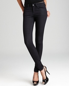 Supple leather back pockets toughen up these GUESS skinny jeans for a cool modern edge.