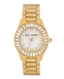 Twenty four hours a day isn't nearly enough time to shine. Watch by Betsey Johnson crafted of gold tone stainless steel bracelet and round case. Bezel embellished with baguette-cut crystal accents. White mother-of-pearl dial features crystal accent markers set in gold tone, gold tone hour and minute hands, signature fuchsia second hand and logo. Quartz movement. Water resistant to 30 meters. Two-year limited warranty.