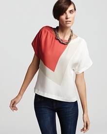 Geometric color block steals the show on this French Connection silk top designed with snaps down the side for unexpectedly cool detail.