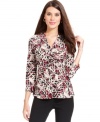 Alfani's top is outfitted in a bold print and ruched for a flattering fit.