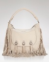 Sam Edelman delivers its latest must-have accessory with this fringed leather hobo. Intricately crafted and detailed, this carryall rises to the top of our it list.