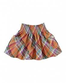 A festive, classic plaid is smocked along the waist and adorned with large patch pockets for an adorable skirt to pair with a favorite top or tee.