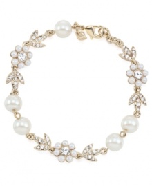 Stunning style is in bloom. Carolee combines imitation pearls and sparkling glass accents into a detailed floral-shaped pattern on this gorgeous link bracelet. Crafted in gold tone mixed metal. Approximate length: 7-1/2 inches.