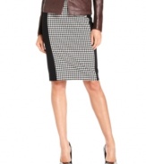 Sophisticated houndstooth alternates with solid panels to give this MICHAEL Michael Kors pencil skirt a fresh, modern feel. Classic pumps keep it polished for work while statement heels give it the right look for a night out.