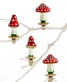 Cap off every branch with a clip-on mushroom ornament from Martha Stewart Collection. Featuring red, white and green accents on molded glass.