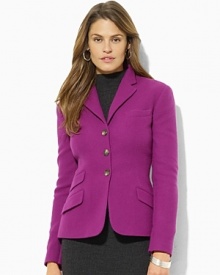 Designed in sophisticated wool tweed, this smartly tailored jacket is an elegant representation of chic, modern style.