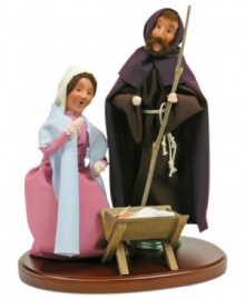 Byers' Choice recreates the very first Christmas with handcrafted figurines. Joseph and Mary crouch adoringly over baby Jesus, who rests peacefully in a crib.