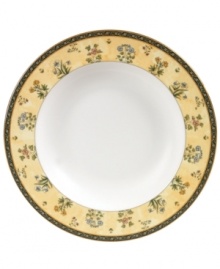 The exotic India dinnerware pattern presents a pattern of exquisitely detailed florals on a yellow and deep blue band against pure white bone china.