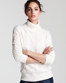 This C by Bloomingdale's cashmere sweater exudes preppy luxe with sumptuous ribbing, cable knitting and a sophisticated silhouette.