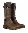 Up the style quotient of your cold weather look with these rugged-luxe shearling boots from Rossano Bisconti - Round toe, chunky sole and block heel, textured leather, mid-shaft length, dual buckle and strap detail, shearling lining - Pair with pleated wool short with ribbed tights and an oversized cashmere sweater