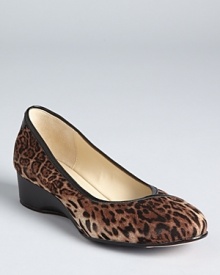 Taryn Rose's Felicity wedges get a roaring update in leopard print fabric, equipped with a subtle one-inch wedge.