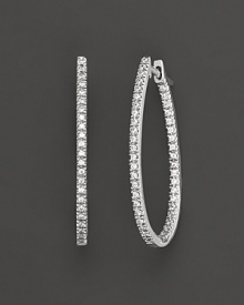 Prong set, inside out oval diamond hoop earrings set in white 14 Kt. gold. With hinged post.