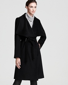 This Calvin Klein coat features a grand cascade collar and a fetching belted waist for refined elegance when temperatures fall.