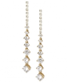 Glistening and glamorous. These linear earrings from Betsey Johnson are crafted from gold-tone mixed metal with faceted crystals providing a radiant look. Approximate drop: 2-1/2 inches.