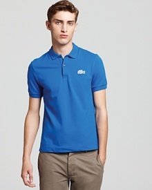 A modernized preppy classic. With an ultra slim fit and a super-sized logo, this stylish polo from Lacoste is a must-have basic.