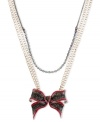 Tie something new. This shimmering bow pendant from Betsey Johnson makes a perfect present for yourself or a loved one. The necklace is crafted from gold and hematite tone mixed metal and features a crystal cup chain accent. Approximate length: 16 inches + 3-inch extender. Approximate drop: 2 inches.