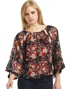 THE LOOKSheer floral designRound neckline Cutout details and drawstring closureThree-quarter length dolman sleeves THE FITAbout 25 from shoulder to hemTHE MATERIALSilkCARE & ORIGINDry cleanImportedModel shown is 5'10 (177cm) wearing US size Small. 