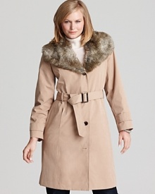 This Calvin Klein trench coat gets a glamorous update with a faux fur neckline--a luxe twist on the perennial favorite.