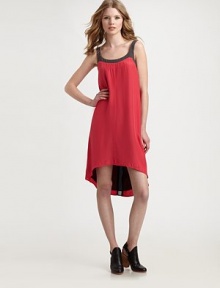 Silk scoopback dress has contrasting trim, adjustable straps and an on-trend hi-lo hem. RoundneckAdjustable strapsSide zipperHi-lo hemScoopbackAbout 17 from natural waist74% modal/26% silk liningSilkDry cleanMade in USA of imported fabricModel shown is 5'10 (177cm) wearing US size Small.