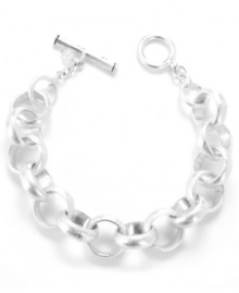 Simplicity is forever stylish. This subtle, shimmering piece from Kenneth Cole New York features rounded links and a chic toggle clasp. Crafted in silver tone mixed metal. Approximate length: 7-1/2 inches.