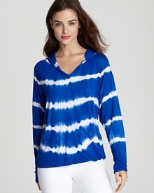 Vintage Havana masters off-duty cool with this tie-dye hoodie--perfect for weekend errands or a day at the beach.