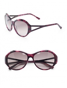 THE LOOKRounded style Variegated acetate framesAustrian crystal temple accentsCutout templesUVA and UVB protection Signature case includedTHE COLORVariegated purple with grey gradient lensesORIGINImported