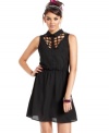 Lattice cutouts supply this femme a-line dress with major downtown edge! From Material Girl.