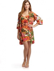 THE LOOKAllover abstract floral printWrap front with cinched drawstring tie closureElbow length sleevesTHE FITAbout 36 from shoulder to hemTHE MATERIALPolyester/spandexCARE & ORIGINMachine washImportedModel shown is 5'10 (177cm) wearing US size Small. 