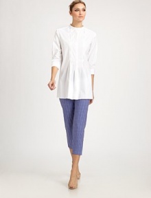 Crisp woven cotton, tailored in a flattering silhouette featuring delicate front pleats.Band collarConcealed button closurePleated frontThree-quarter sleeves with button cuffsInset back panelAbout 30 from shoulder to hem83% cotton/14% polyamide/3% elastaneDry cleanMade in Italy of imported fabric Model shown is 5'11 (180cm) wearing US size 4.OUR FIT MODEL RECOMMENDS ordering true size. 