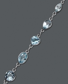 Let ocean-inspired color wash over you. Pretty round and oval-cut blue topaz gemstones (8 ct. t.w.) shine in a 14k white gold setting. Approximate length: 7 inches.