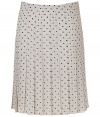 Elegant pleated skirt in fine ivory silk - Retro chic meets modern sophistication - On-trend black polka dot motif - Slim cut, hits at knees - Pleats swing lightly when walking - Polished, smart and sexy, ideal for work, cocktails and parties - Pair with a twin set or blazer and button down blouse, style with pumps or mules