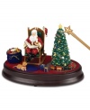 The holiday spirit comes to life in this Night Before Christmas collectible. Use the magical wand to activate a multitude of features: Santa rocks in his chair while reciting The Night Before Christmas, the tree and candle light up and a train circles the tree.