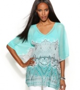 A unique print revs up INC's softly-draped peplum hem tunic. Try it with shorts to balance the flowing fit.