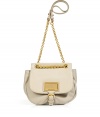 Enviable Marc Jacobs shoulder bag in fine cream-colored leather - A modern classic with a cool, bulbous shape, gold-colored chain strap, flap closure and gold-colored logo plaque - Convenient cross-body option - Thoughtful interior compartments for excellent organization - Favorite, functional bag for everyday