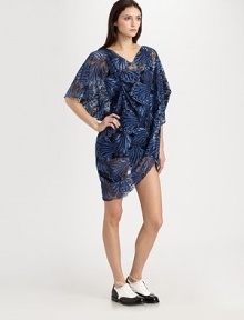 Lacy embroidery in a dramatic pattern dresses up this sheer, artfully draped design.V necklineShort sleevesFront drapeScalloped hemlineAllover nylon embroideryRayonDry cleanImportedModel shown is 5'11 (180cm) wearing US size Small. 