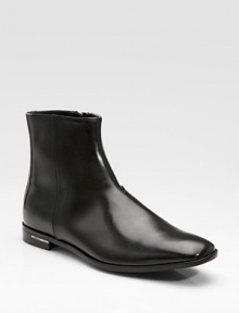 An elegant dress boot is designed in calfskin leather with side zips for easy on and off. Leather lining Padded insole Leather sole Made in Italy 